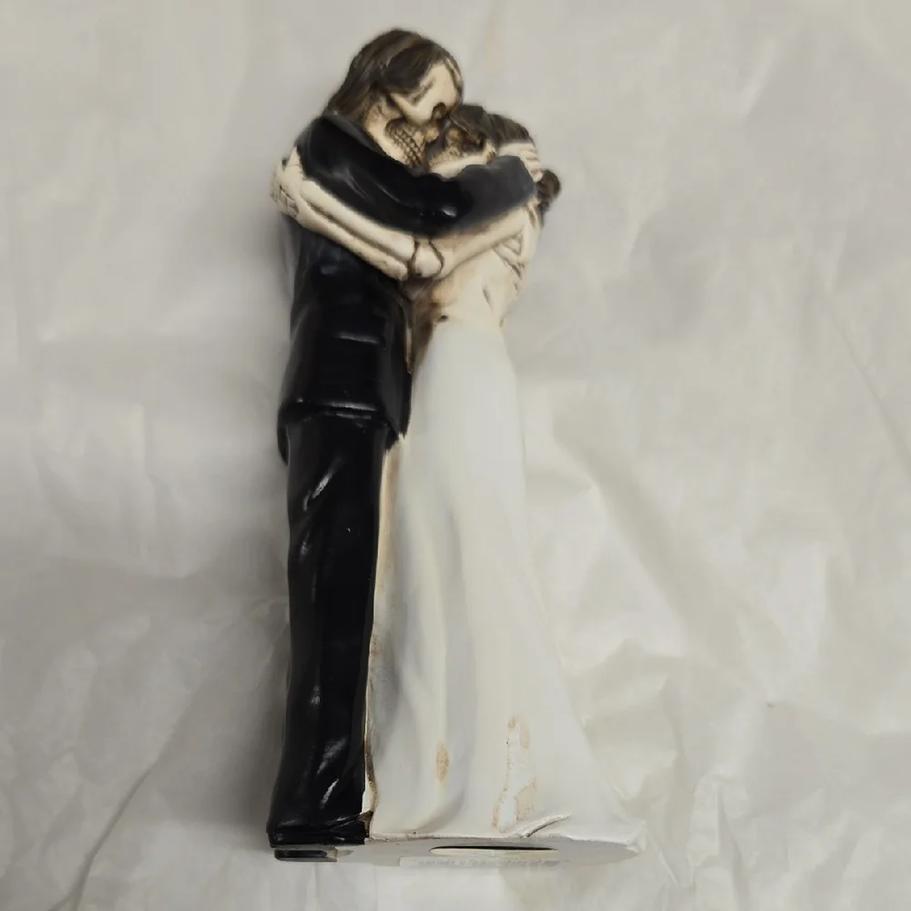 Elegant Black and White Embracing Couple Figurine